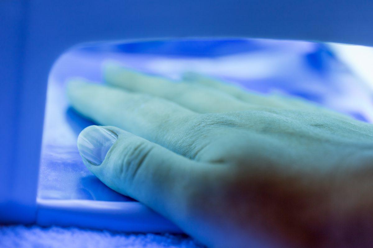 Nails with gel polish in a uv lamp