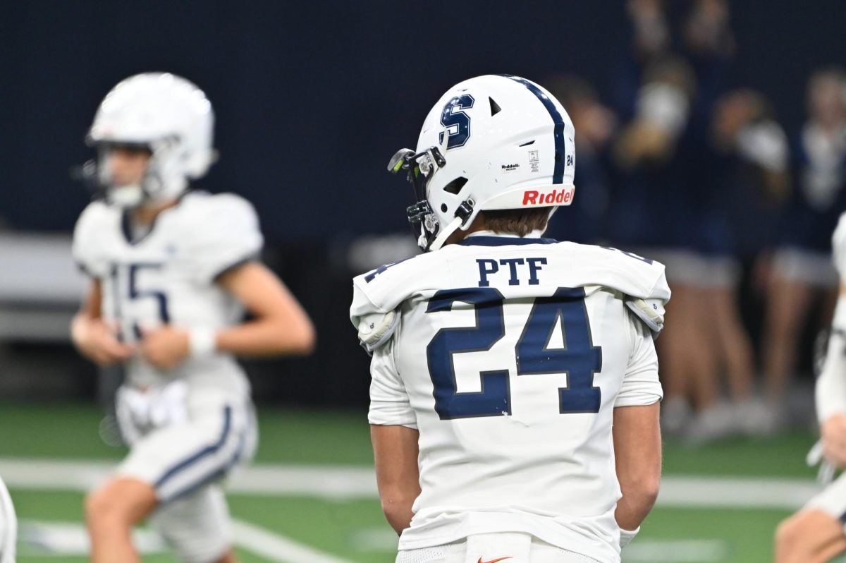 Dean Watkins '26 stretches before the Battle of the Star game against the Episcopal School of Dallas at the Star in Frisco, TX on September 21, 2024.